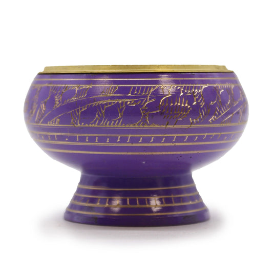 Purple bowl with gold embossed design on a white background