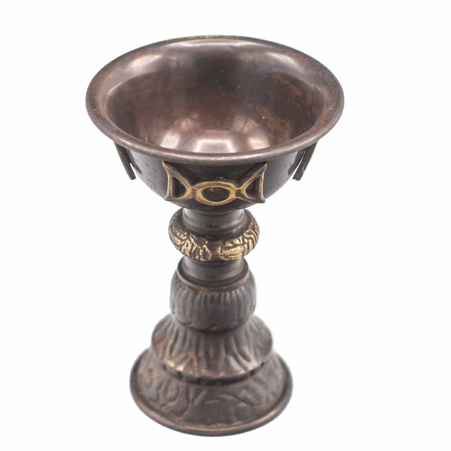 Bronze goblet with intricate designs on a white background